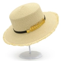 Detail of boater hat with gold leaf charm, black leather band, and fringe brim - One Size / Beige
