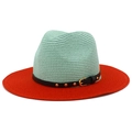 Detail view of two-tone straw hat featuring mint green crown and orange brim with studs - One Size / Mint & Orange (10#)