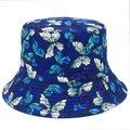 Close-up of vibrant butterfly print on dark blue bucket hat with quality stitching - Blue