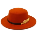 Detailed shot of orange wool felt flat top boater hat with black band and gold leaf pin - Dark Orange