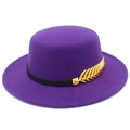 Detailed close-up of purple wool felt hat with black leather band and gold wheat accessory - Deep purple
