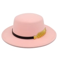 Close-up of pink felt fedora with a black band and gold wheat shaped metal accent - Pink
