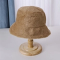 Classic brown plush bucket hat for women on wooden stand for autumn and winter warmth - Brown