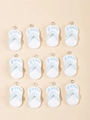Detailed view of 12 mini resin flip-flop charms with blue footprints for DIY jewelry making - Blue