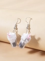 Detail view of miniature ice cream sundae earrings with cream and pink straw - Off-White