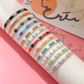 Set of 11 colorful handmade woven Tila bead bracelets with adjustable cord on display - Double Row Seed Bead Style (PZ231110002)