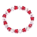 Détail de perles papillon en verre coloré et de cristaux scintillants aux reflets arc-en-ciel - Rouge