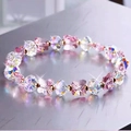 Buntes Glasperlenarmband mit glitzernden Schmetterlingsperlen und goldenen Akzenten - Rosa