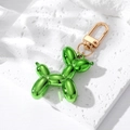 Detail of green metallic resin balloon dog keychain with gold-plated metal hook - Dark Green