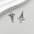 Close-up of vintage silver caduceus charms with wings for DIY jewelry making - Medical Caduceus (10442) / 12*27mm