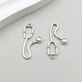 Detailed macro view of two antique silver stethoscope charms for DIY jewelry making - Medical Stethoscope (10604) / 14*28mm