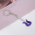 Detailed macro view of a purple electric guitar keychain with silver alloy accents - Purple Guitar Keychain