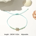 Detail view of adjustable sea turtle woven bracelet with length 28cm measurement - Rhinestone Sea Turtle Style / 12 Pieces / Colorful