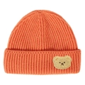 Detail of the thick vertical ribbed knit and cute bear patch on this bright orange beanie - Orange