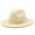 Detail of a creamy white fedora hat with a matching satin ribbon and bow on the side - One Size / Beige