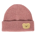 Detailed view of pink knitted beanie with a yellow teddy bear patch and ribbed texture - Taro