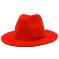 Detail of red wide brim fedora hat featuring a matching ribbon bow and fine wool texture - Red
