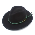 Detail of black wool fedora hat featuring green tassel trim and gold metallic buckle - Black