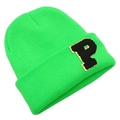 Detailed view of neon green ribbed knit beanie with black and gold letter P patch - Green