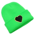 Close-up of bright green knitted beanie featuring a black heart patch with gold glitter edge - Green