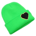 Detail of neon green knit beanie featuring a black heart patch with gold glitter borders - One Size / Green