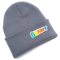Close-up of grey ribbed knit beanie featuring colorful embroidered Bunny letters - Gray