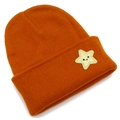Fashionable knitted beanie in burnt orange with a yellow star smile patch and ribbed texture - Caramel color