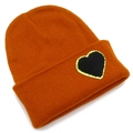 Orange ribbed knit beanie with a stylish black heart patch and golden sequin border - One Size / Caramel color