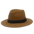 Detailed view of the fine woven texture and black ribbon band on a brown Panama fedora hat - Coffee