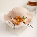 Women's wide brim straw sun hat with wavy lace edges and floral sunflower decoration - One Size / Pink