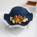 Navy blue wide brim straw hat with white scalloped lace edges and sunflower accents - One Size / Dark Blue
