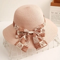 Elegant pink straw sun hat with printed ribbon bow for summer beach vacation style - Pink