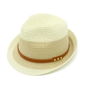 Macro detail of bicolor straw hat texture with brown faux leather band and gold metal studs - Cream And Khaki