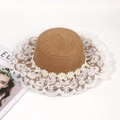 Women's woven straw sun hat with white lace brim and daisy flower decorations - One Size / Brown