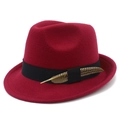Detail view of burgundy felt fedora hat featuring a black band and a patterned feather accent - Burgundy