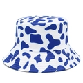 Detailed view of bucket hat with blue and white cow print and reinforced brim stitching - Navy Blue Cow Print