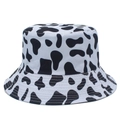 Close-up of black and white cow print bucket hat with high-quality twill fabric texture - Black Spot Cow Print