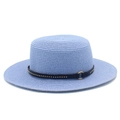 Detail of light blue straw boater hat featuring a black leather band with metallic studs - Light Blue