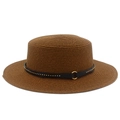 Detail of caramel straw hat featuring a black leather band with gold studs and a metal ring - Coffee
