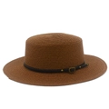 Close-up of brown straw boater hat featuring a leather band with gold buckles and studs - Coffee