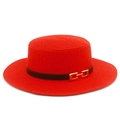 Close-up of red straw boater hat featuring fine woven texture and black leather strap detail - One Size / Red