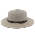 Detail of straw boater hat featuring a studded black leather band and golden ring buckle - Gray