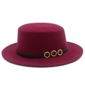 Close-up of wine red flat top felt hat with black belt and three golden diamond ornaments - Burgundy