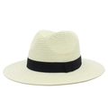 Close-up of beige straw sun hat featuring a classic black ribbon band and fine woven texture - One Size / Cream