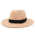Close-up detail of the fine woven texture and black ribbon on a beige Panama straw hat - One Size / Flesh Pink