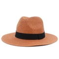 Close-up of caramel straw fedora hat featuring detailed spiral weave and black ribbon bow - One Size / Dusty Pink