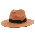 Close-up of brown woven straw hat with black grosgrain ribbon and classic bow detail - Deep Pink