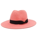 Detail of coral pink straw fedora hat with a black grosgrain ribbon and side bow tie - Pink