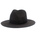 Detailed view of the dark straw sun hat texture and elegant black grosgrain ribbon bow - Black