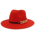 Detail of red woven sun hat with black leather band and chunky gold chain buckle - Red